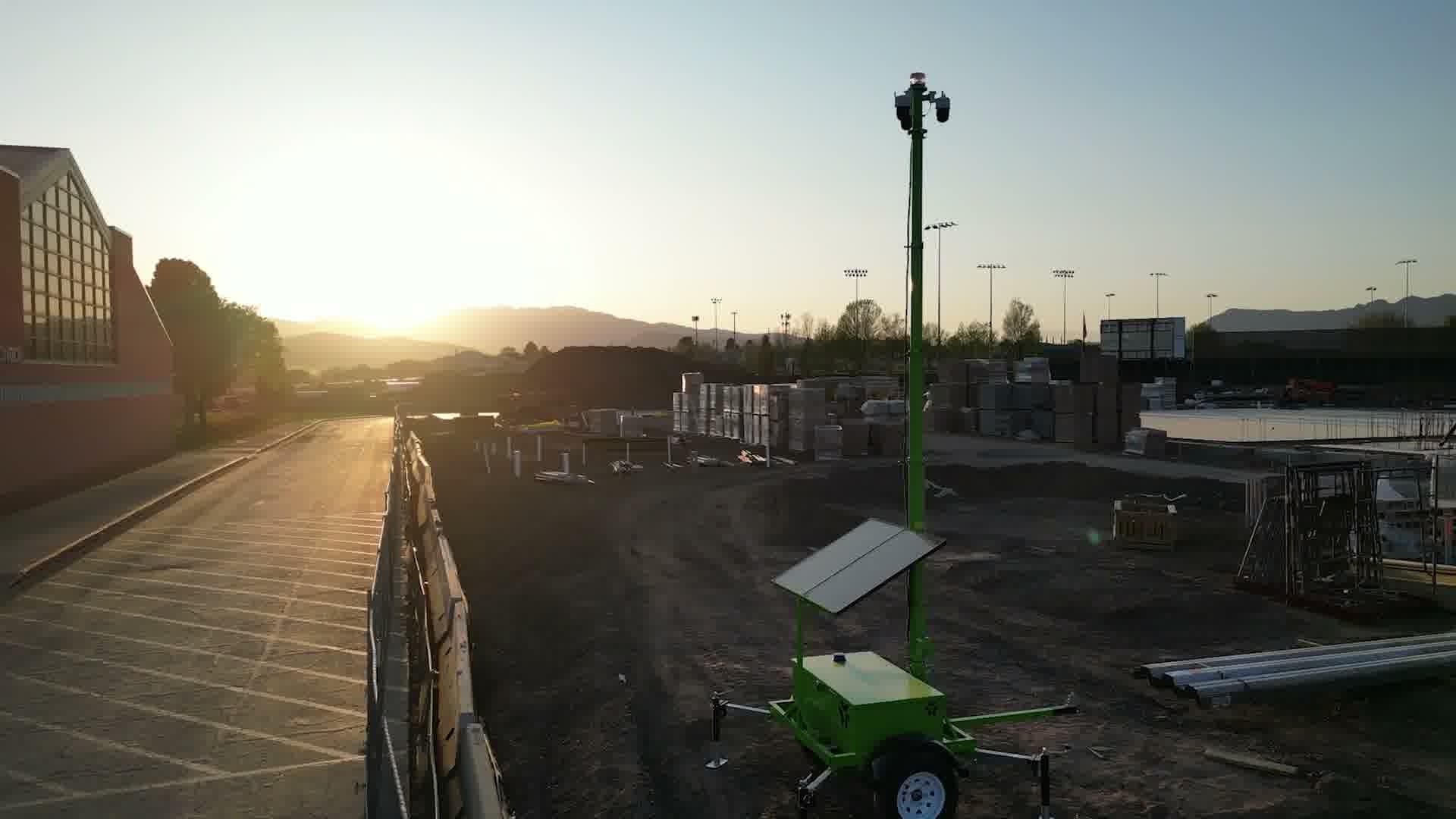 Camera trailer overlooking a jobsite near St. George red rock terrain at sunset